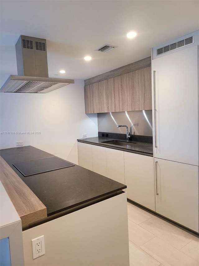 1000 Brickell Plz Unit 4314, Miami, FL 33131 - kitchen featuring island exhaust hood, black electric cooktop, dark countertops, modern cabinets, and recessed lighting