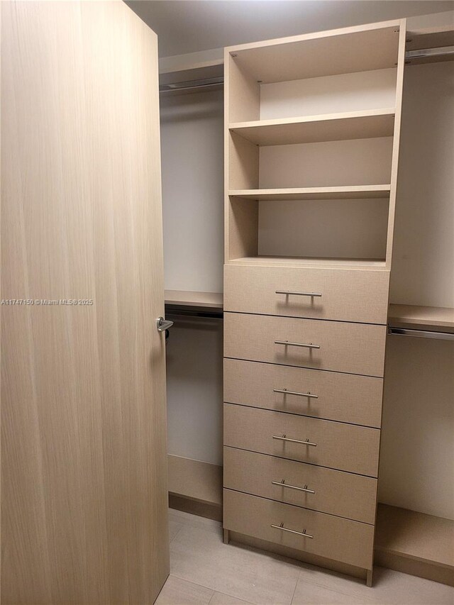 1000 Brickell Plz Unit 4314, Miami, FL 33131 - spacious closet with light tile patterned flooring