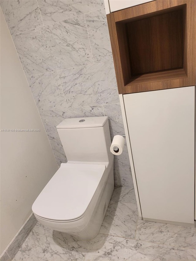 1000 Brickell Plz Unit 4314, Miami, FL 33131 - bathroom with marble look tile flooring