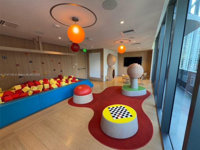 1000 Brickell Plz Unit 4314, Miami, FL 33131 - playroom featuring recessed lighting and wooden walls