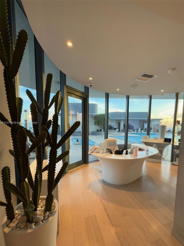 1000 Brickell Plz Unit 4314, Miami, FL 33131 - interior space featuring light wood-style flooring, visible vents, a wall of windows, and recessed lighting
