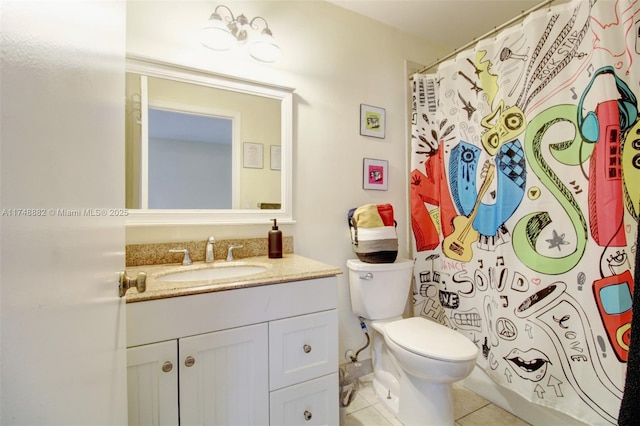 bathroom featuring curtained shower, vanity, toilet, and tile patterned floors