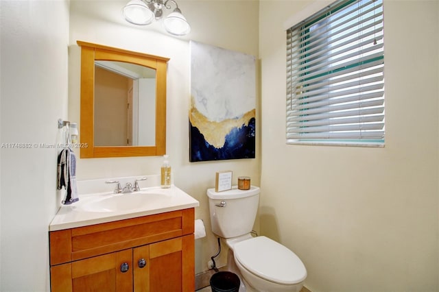 half bath with toilet and vanity