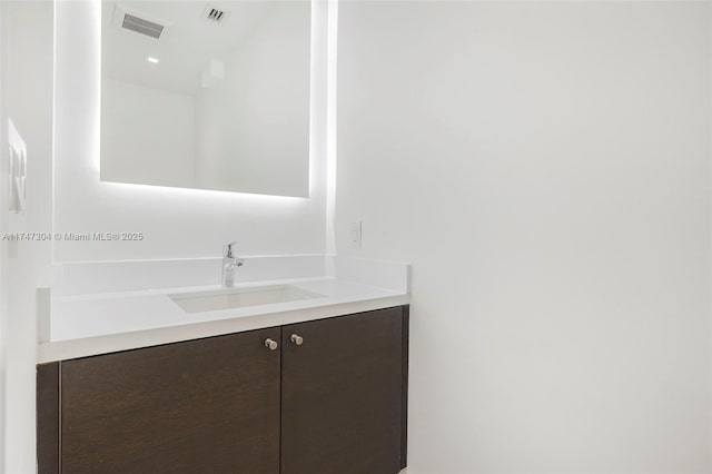 bathroom featuring visible vents and vanity