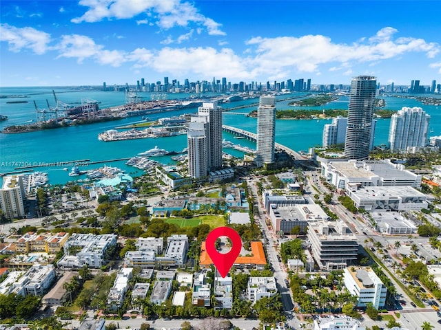 drone / aerial view featuring a water view and a city view