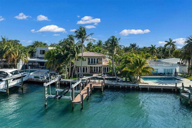 view of dock with a water view, boat lift, and an outdoor pool