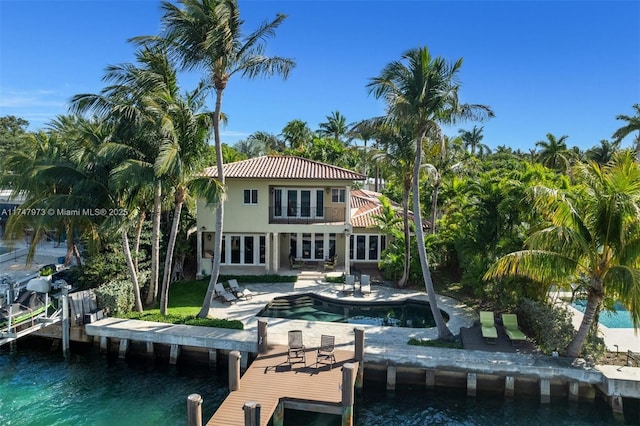 dock area featuring an outdoor pool, a water view, and a patio