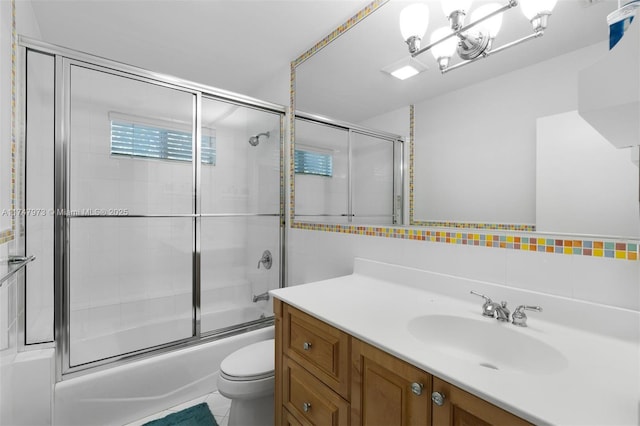 full bathroom with toilet, shower / bath combination with glass door, vanity, tile walls, and decorative backsplash