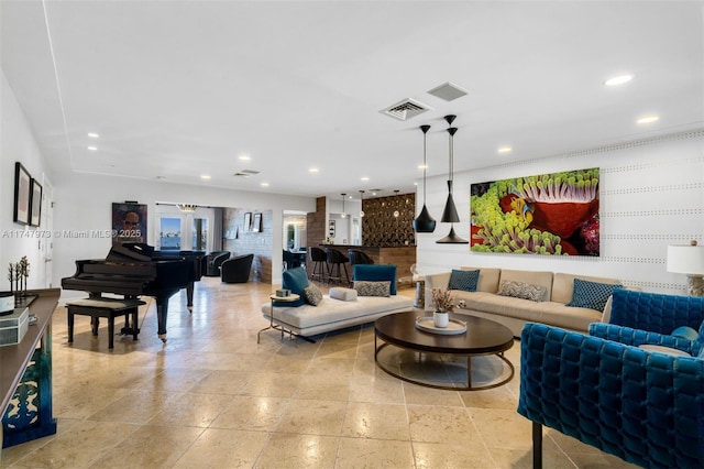 living area with recessed lighting and visible vents