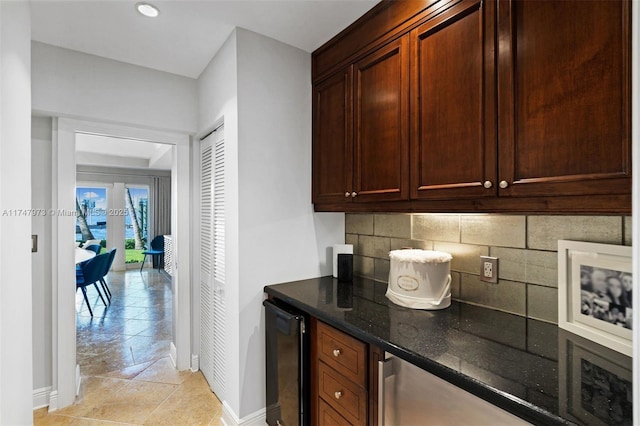 bar with tasteful backsplash, wine cooler, and baseboards