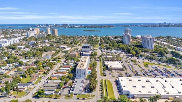 birds eye view of property featuring a view of city and a water view