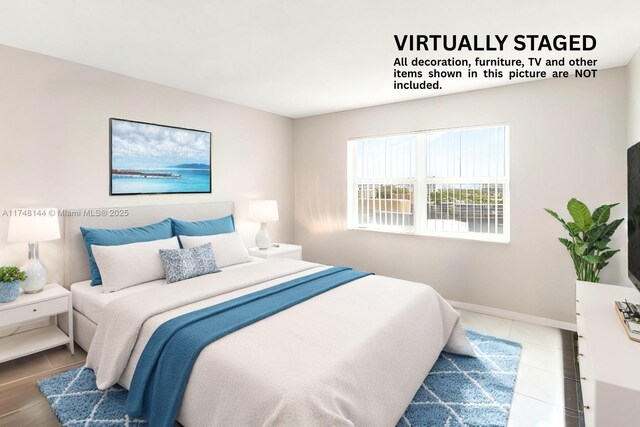 tiled bedroom with baseboards