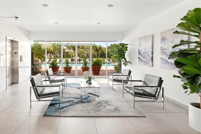 sunroom / solarium featuring elevator