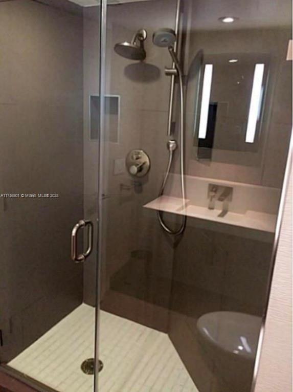 bathroom featuring a stall shower