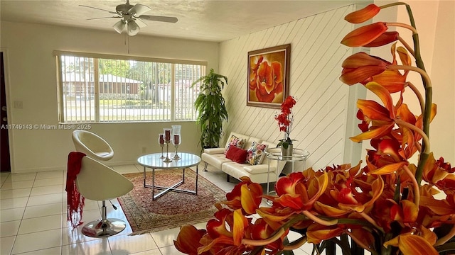 interior space featuring a ceiling fan and light tile patterned floors