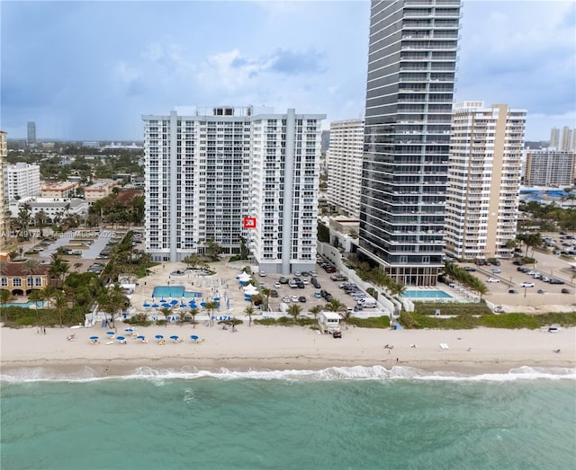 bird's eye view with a view of the beach, a city view, and a water view