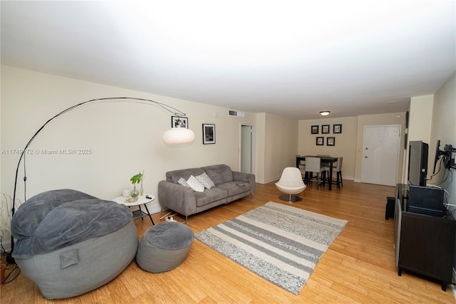 2030 S Ocean Dr Unit 618, Hallandale Beach, FL 33009 - living room featuring light wood-style flooring, visible vents, and baseboards
