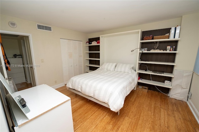 2030 S Ocean Dr Unit 618, Hallandale Beach, FL 33009 - bedroom with baseboards, a closet, visible vents, and wood finished floors