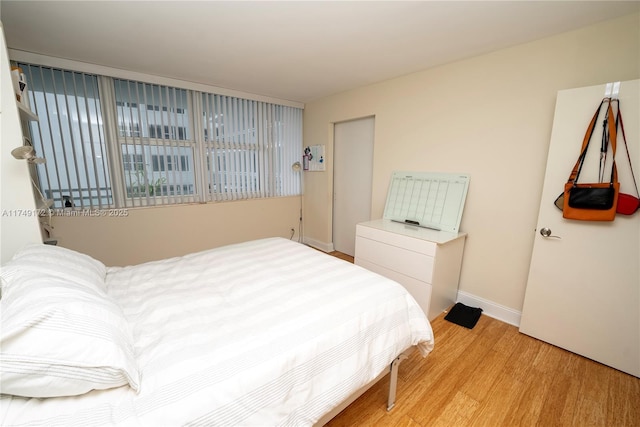 2030 S Ocean Dr Unit 618, Hallandale Beach, FL 33009 - bedroom featuring baseboards and wood finished floors
