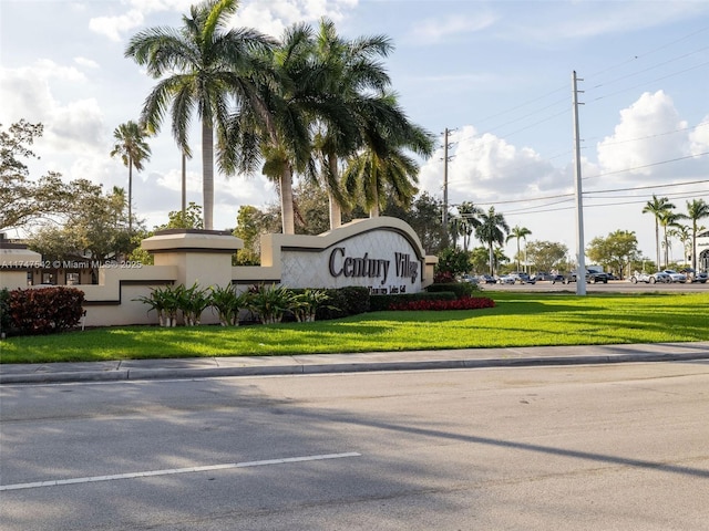 community / neighborhood sign with a lawn