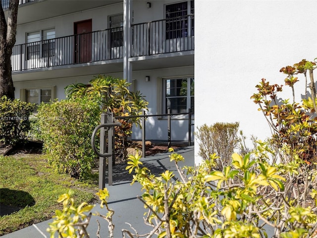 exterior space featuring a balcony and stucco siding