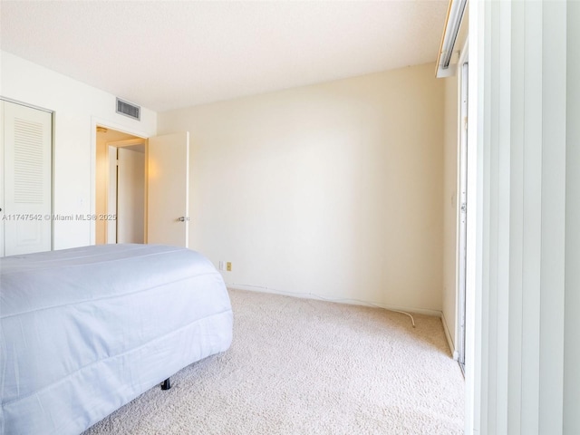 bedroom with carpet floors and visible vents