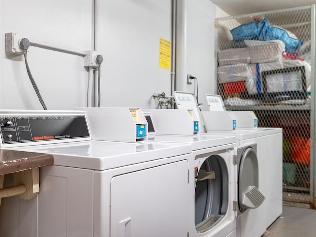 community laundry room featuring washer and clothes dryer