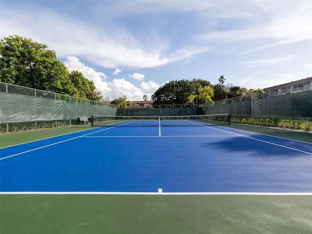 view of tennis court with fence