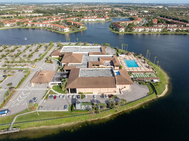 birds eye view of property featuring a residential view and a water view