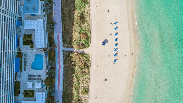 drone / aerial view with a view of the beach and a water view