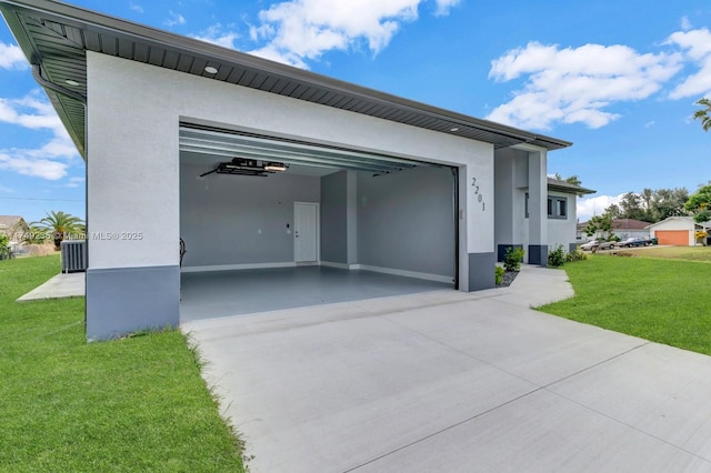 garage featuring driveway and central air condition unit