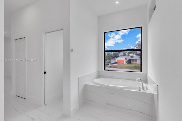 full bath featuring marble finish floor, a closet, a bath, and recessed lighting