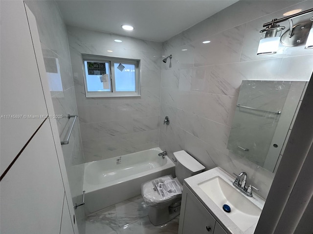 full bath featuring vanity,  shower combination, toilet, and marble finish floor