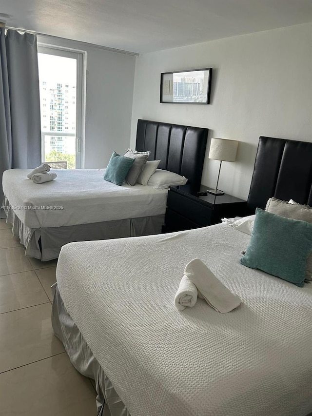 bedroom featuring light tile patterned floors