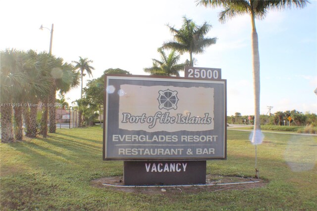 242 Newport Unit 502, Naples, FL 34114 - community sign with a lawn
