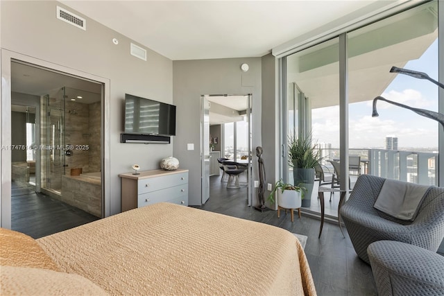 bedroom with dark wood-style floors and visible vents