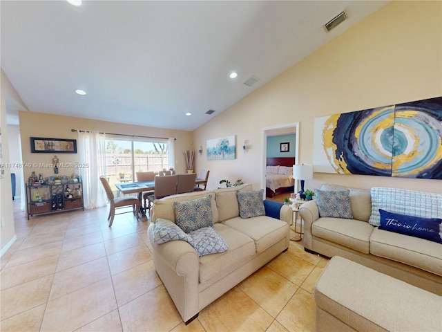 living room with light tile patterned floors, high vaulted ceiling, visible vents, and recessed lighting