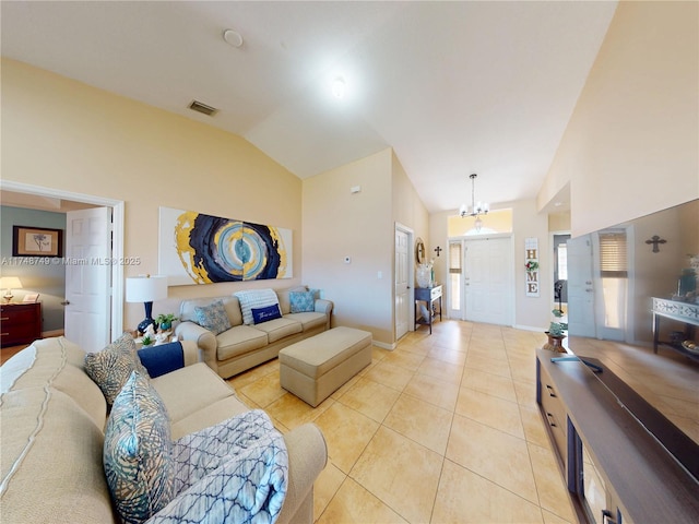 living area with light tile patterned floors, baseboards, visible vents, high vaulted ceiling, and a chandelier