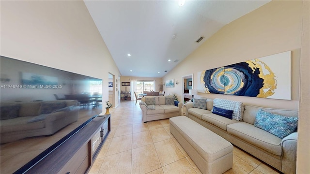 living area with high vaulted ceiling, recessed lighting, visible vents, and light tile patterned floors