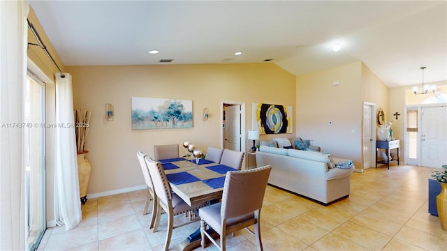 dining area with light tile patterned floors, visible vents, baseboards, vaulted ceiling, and an inviting chandelier