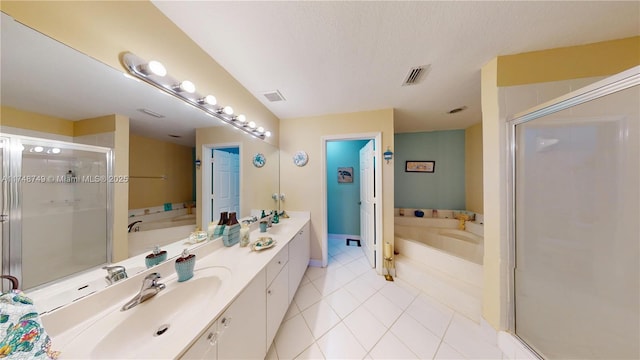 full bathroom with a garden tub, a shower stall, visible vents, and vanity