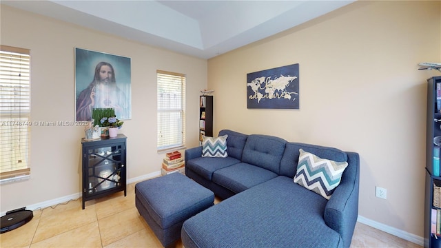 living room with light tile patterned flooring and baseboards