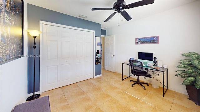office area with baseboards, visible vents, ceiling fan, and tile patterned floors
