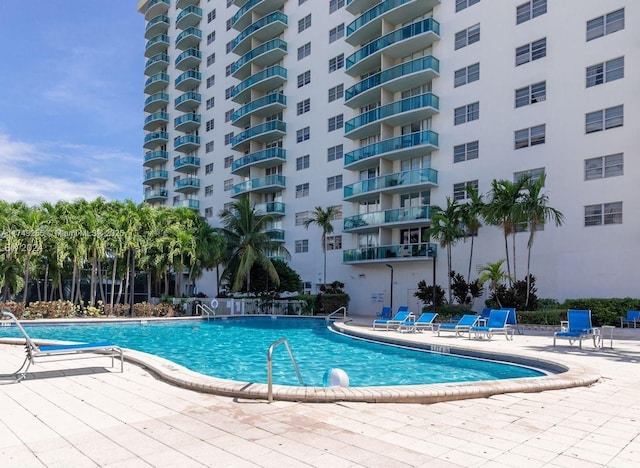 community pool featuring a patio area