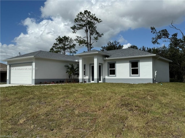 view of front of property with a front lawn, an attached garage, a shingled roof, and stucco siding