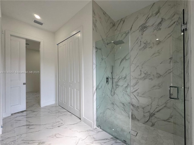 bathroom featuring a closet, marble finish floor, visible vents, and a marble finish shower