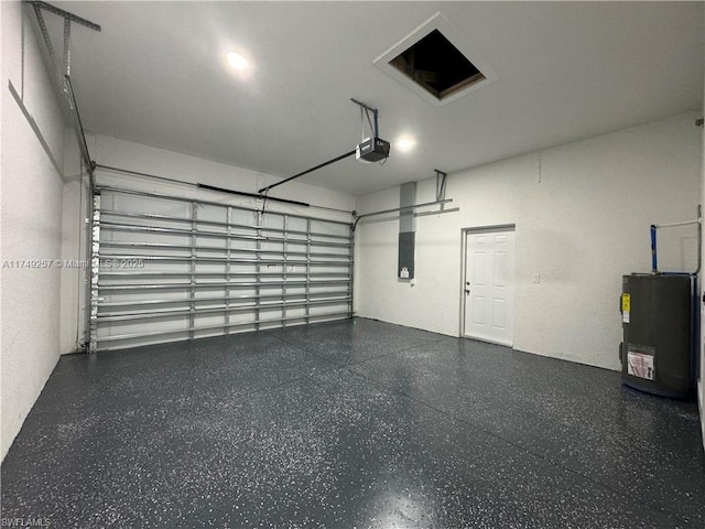 garage featuring water heater, electric panel, and a garage door opener