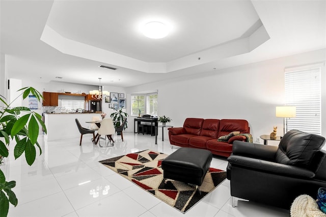18408 NE 27th Ct Unit 18408, Aventura, FL 33160 - living room with a raised ceiling, a chandelier, and light tile patterned floors