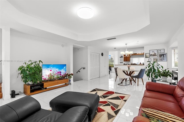 18408 NE 27th Ct Unit 18408, Aventura, FL 33160 - living room featuring a tray ceiling and a chandelier