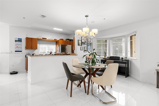 18408 NE 27th Ct Unit 18408, Aventura, FL 33160 - dining space featuring a chandelier and light tile patterned flooring
